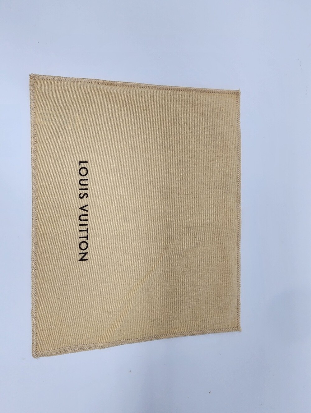 “Authentic Louis Vuitton dust bag.